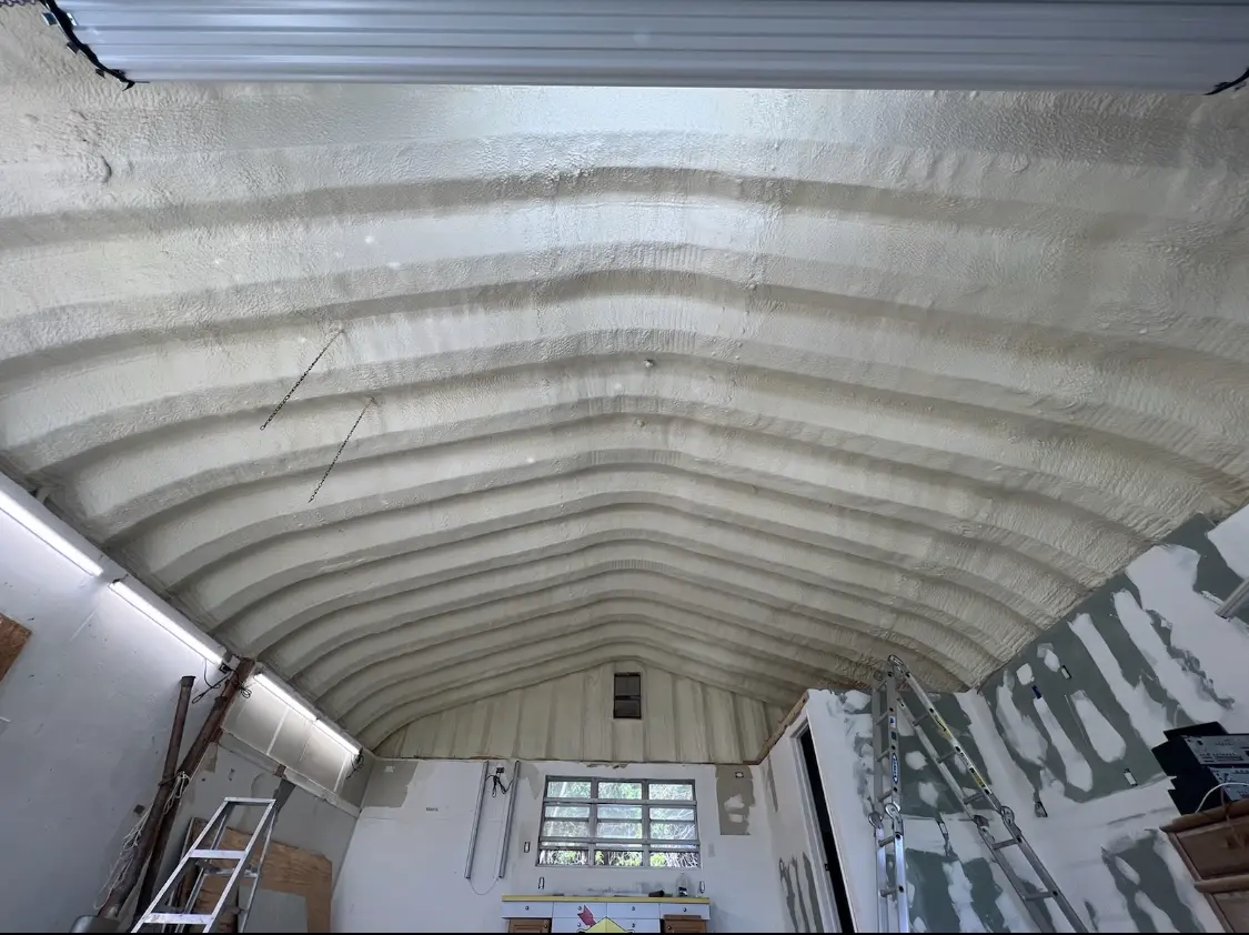 Spray polyurethane foam applied to the underside of a metal roof deck in Sunbury